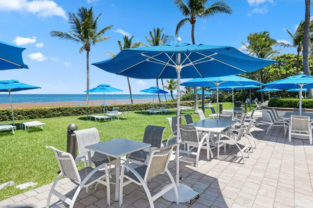 a view of an chairs and tables in the patio