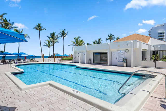 a view of a house with backyard porch and furniture