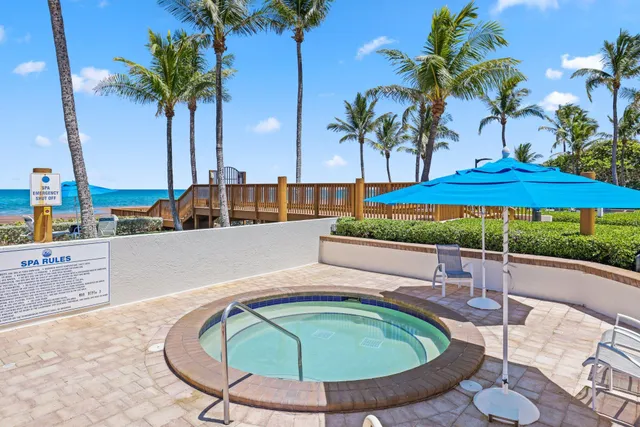 swimming pool view with a seating space