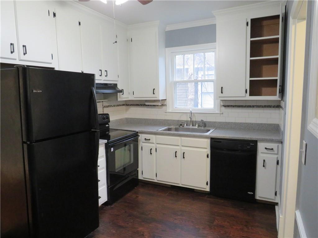 126 Marshall Street Cedartown, GA 30125 - Photo 11 of 12 a kitchen with a refrigerator stove and sink