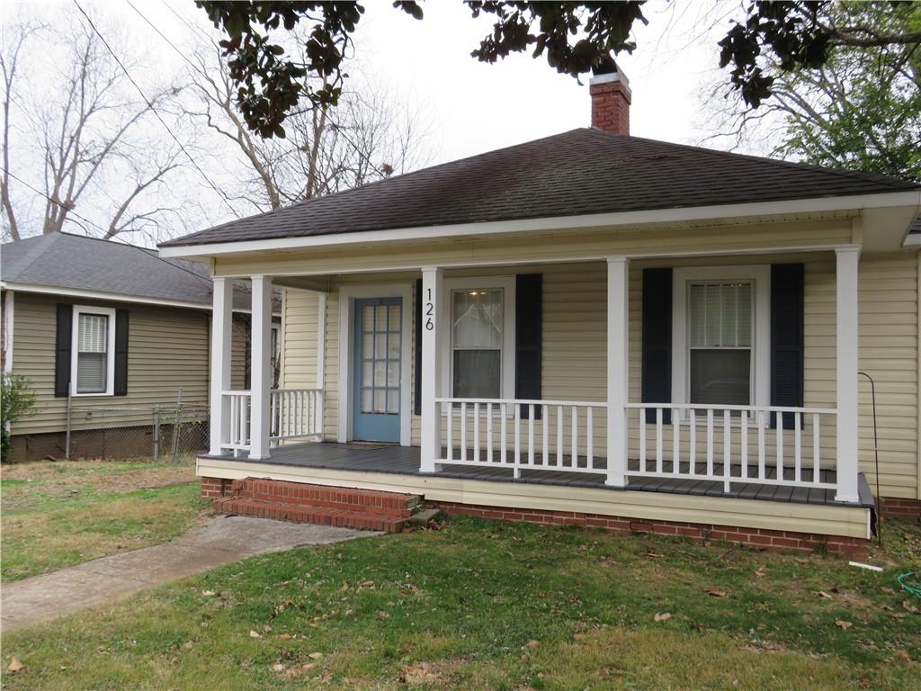 126 Marshall Street Cedartown, GA 30125 - Photo 3 of 12 a view of a house with a yard and a large tree