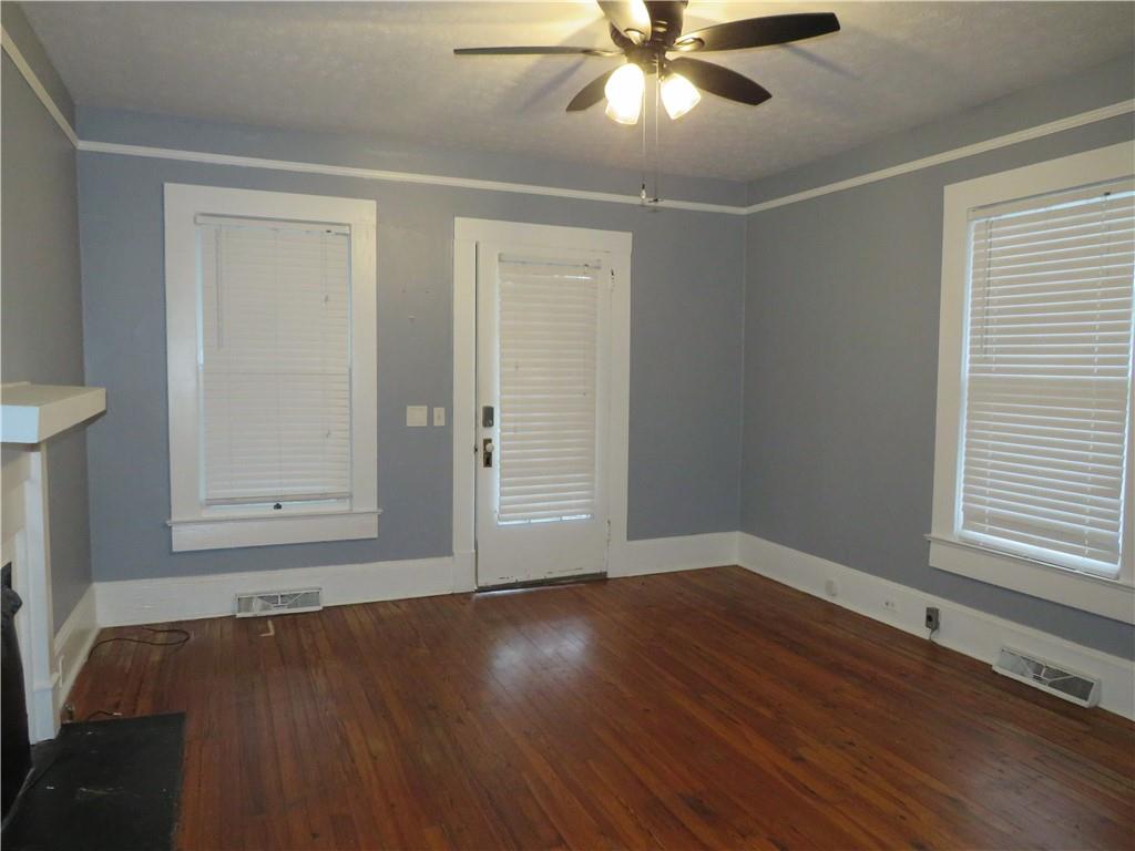 126 Marshall Street Cedartown, GA 30125 - Photo 5 of 12 a view of an empty room with wooden floor and a window