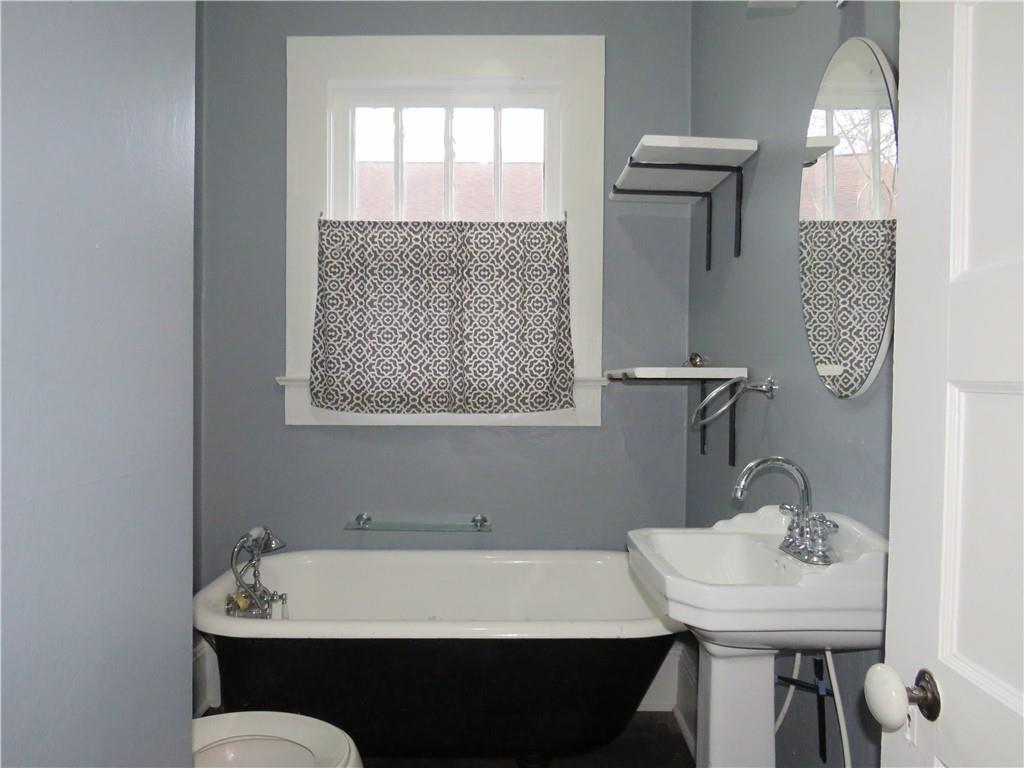 126 Marshall Street Cedartown, GA 30125 - Photo 7 of 12 a bathroom with a sink and a mirror