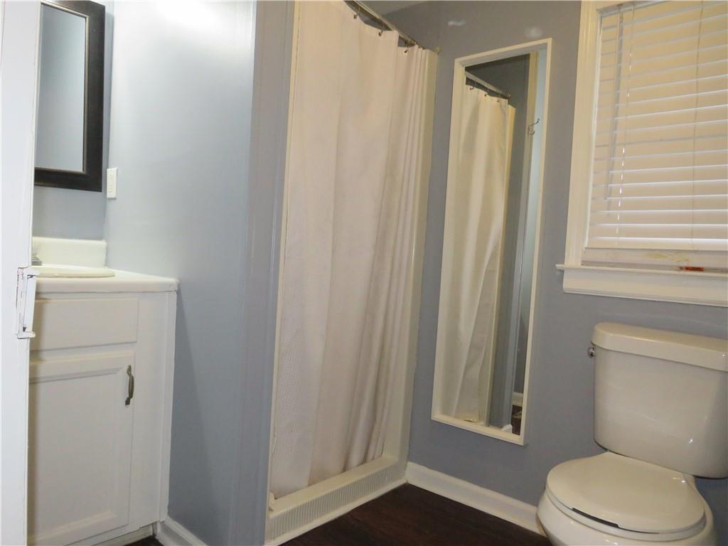 126 Marshall Street Cedartown, GA 30125 - Photo 8 of 12 a white toilet sitting next to a bathroom sink