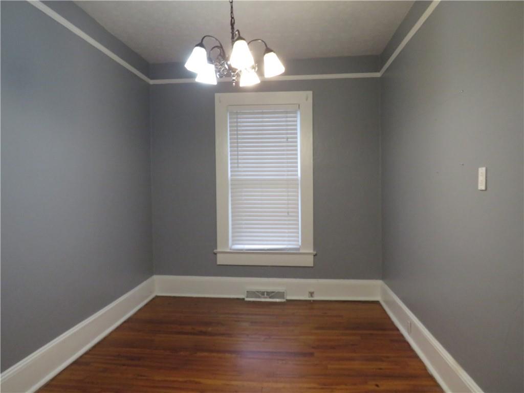 126 Marshall Street Cedartown, GA 30125 - Photo 10 of 12 a view of an empty room with wooden floor and a window