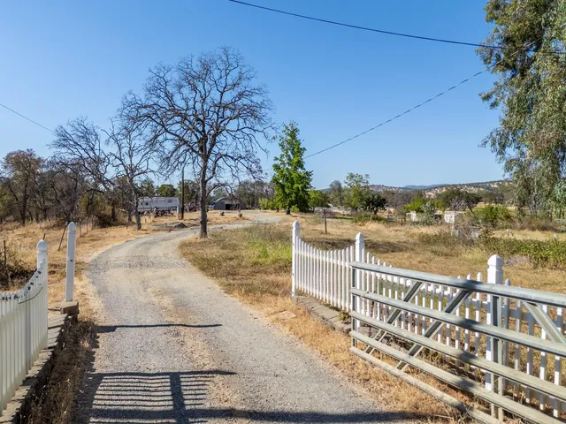 a view of a lake with a yard