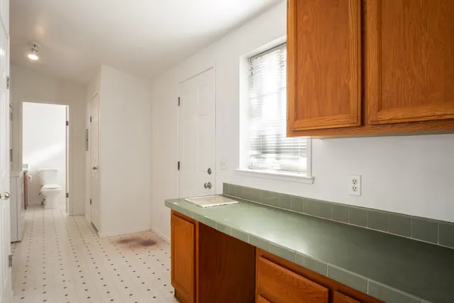 a kitchen with a sink and a window