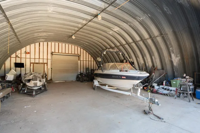 a view of a backyard with wooden fence