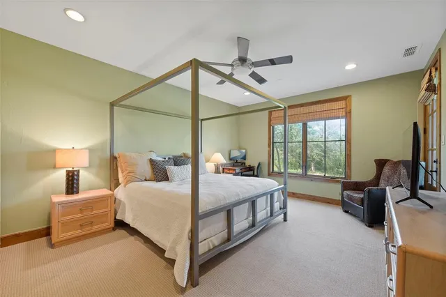 a bed room with a bed and a couch