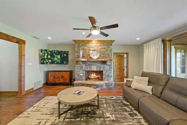 a living room with furniture and a fireplace