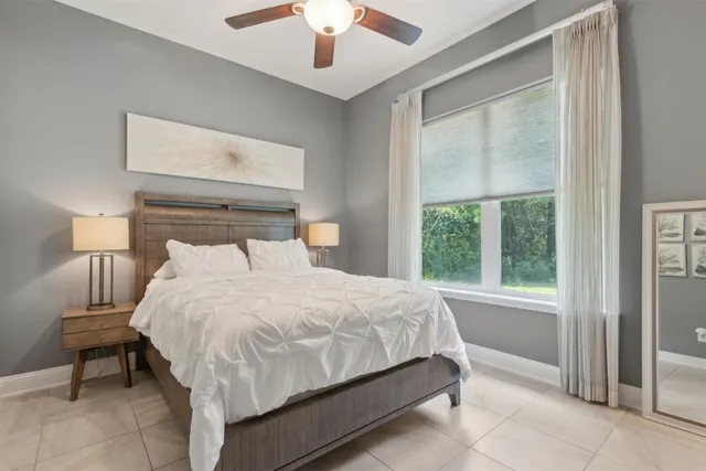 a large white bed in a white room