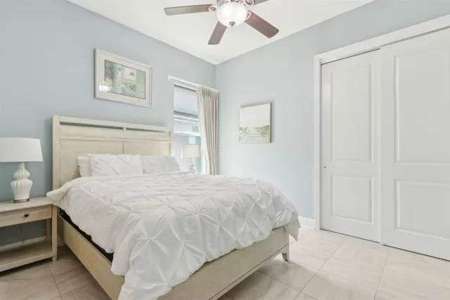 a view of a patio with a table and chairs under an umbrella