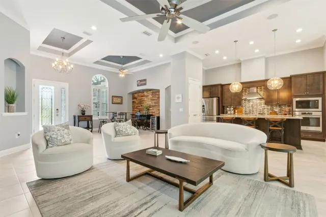 a large kitchen with a table and chairs in it