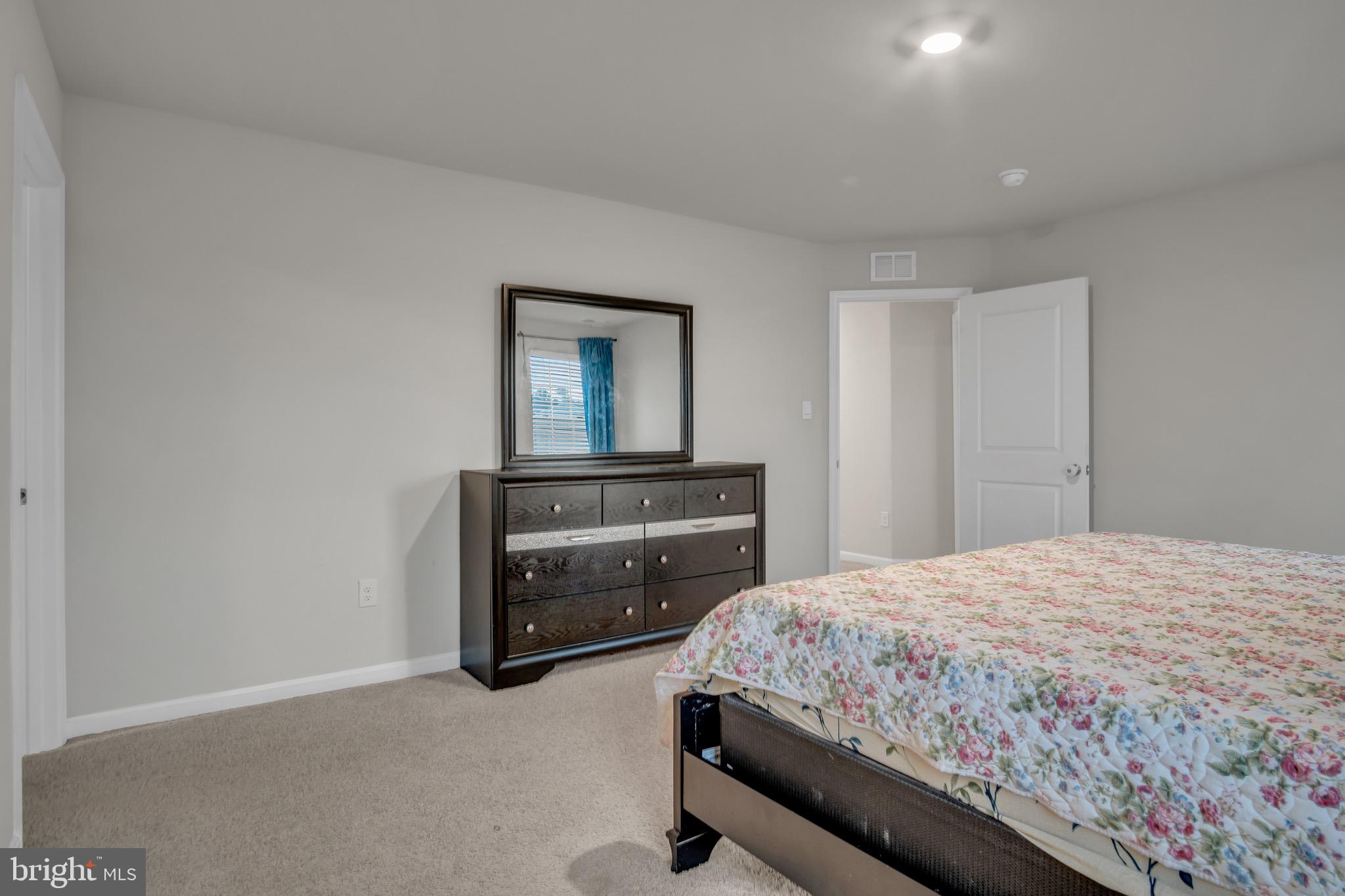 18 Smokehouse Road Carlisle, PA 17013 - Photo 16 of 33 a bedroom with a bed and a dresser