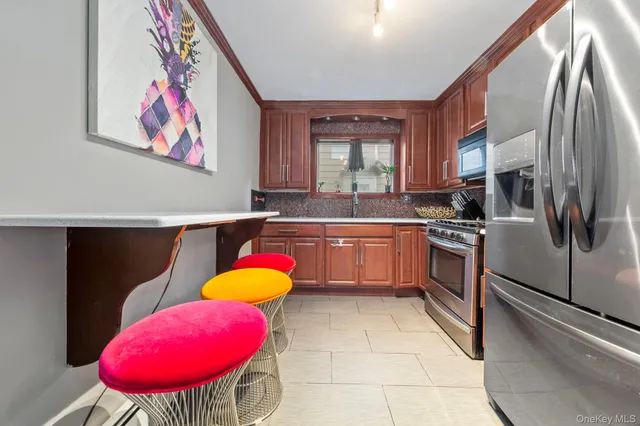 a kitchen with a sink cabinets and appliances