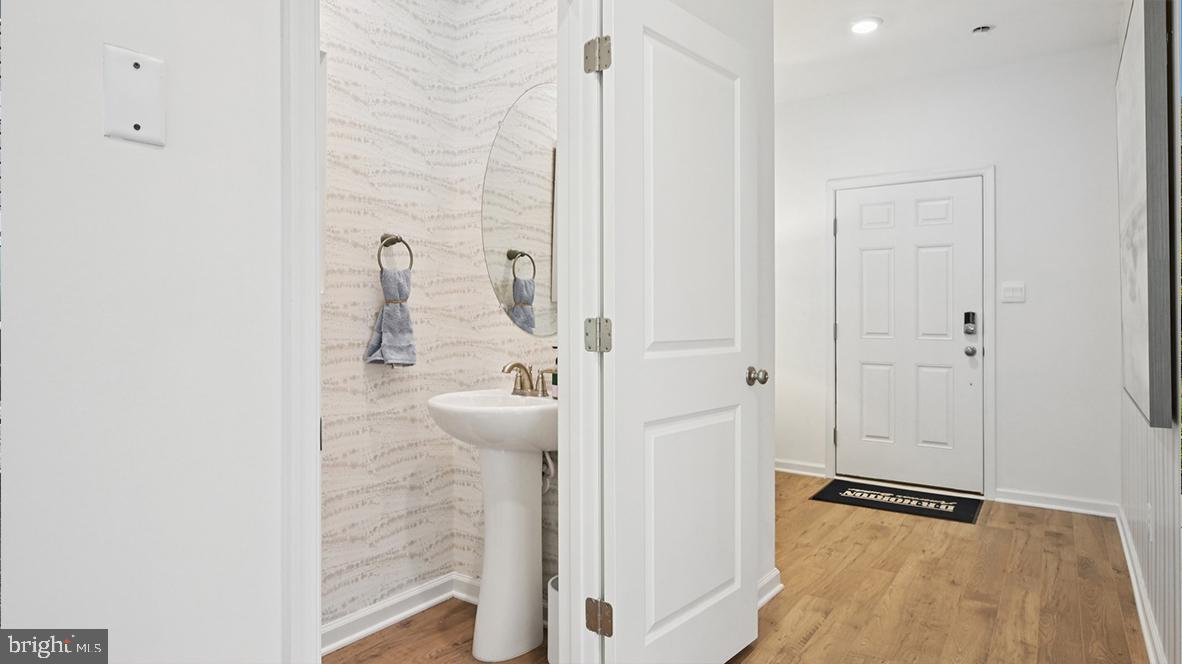 607 Scotty Boulevard, Unit 1401 Rio Grande, NJ 08242 - Photo 6 of 55 a bathroom with a granite countertop shower and a sink