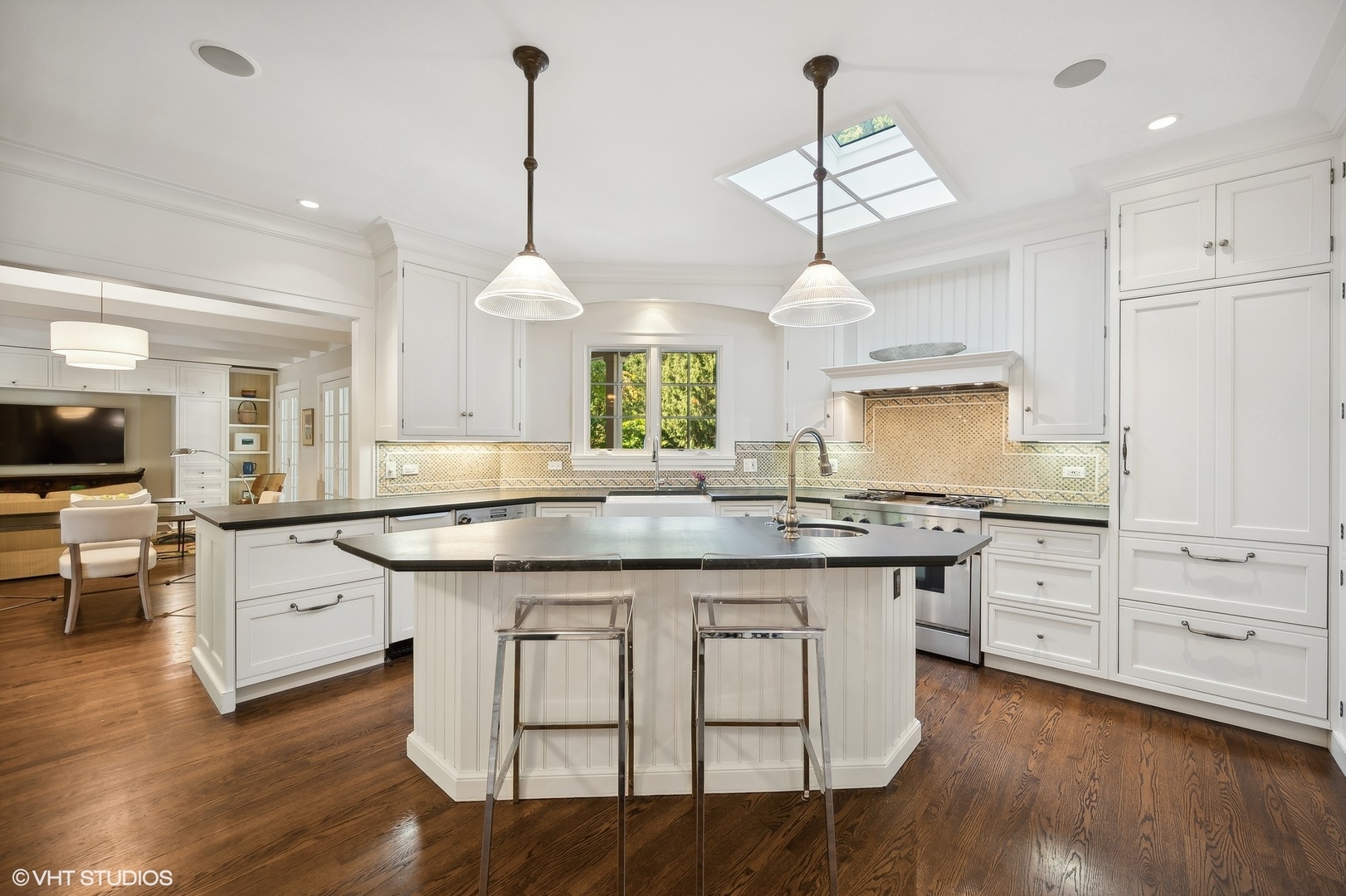 1015 Dinsmore Road Winnetka, IL 60093 - Photo 17 of 46 a kitchen with granite countertop a sink cabinets and wooden floor