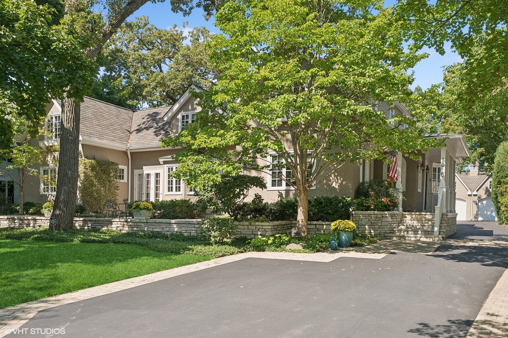 1015 Dinsmore Road Winnetka, IL 60093 - Photo 2 of 46 front view of a house with a yard and tree s