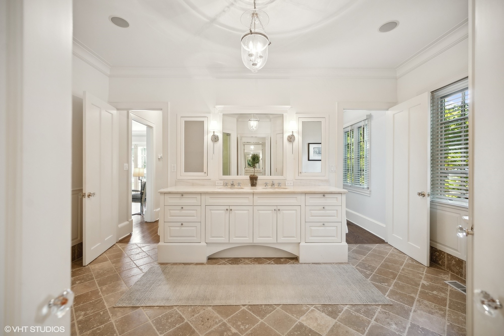 1015 Dinsmore Road Winnetka, IL 60093 - Photo 28 of 46 a bathroom with a sink a mirror and a shower