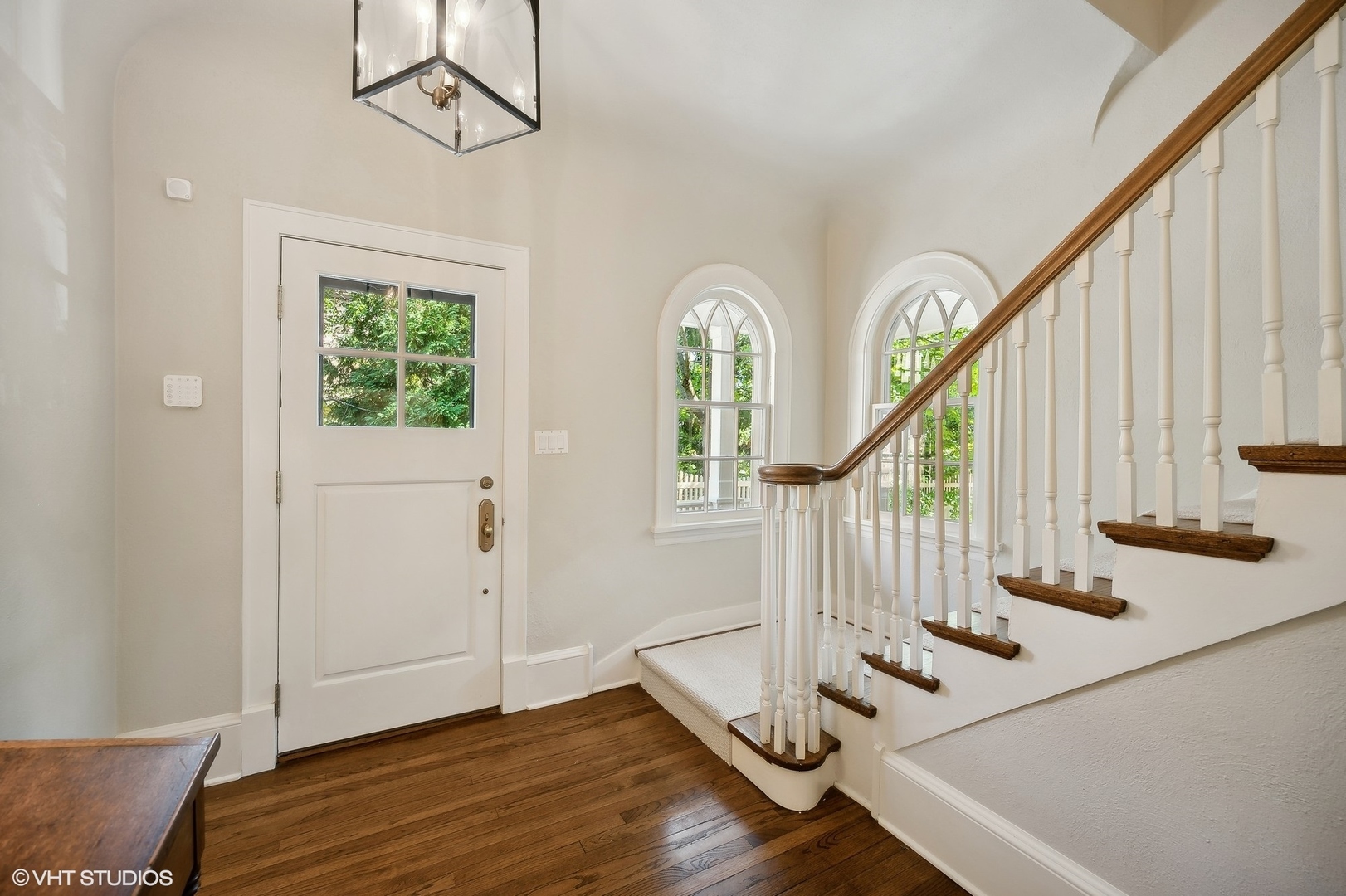 1015 Dinsmore Road Winnetka, IL 60093 - Photo 7 of 46 a view of an entryway with wooden floor and staircase