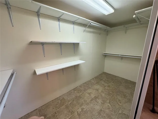 a view of an empty walk in closet