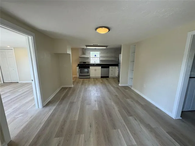 a view of kitchen and wooden floor