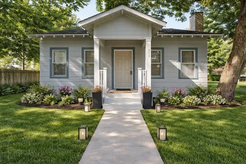 a front view of a house with a yard