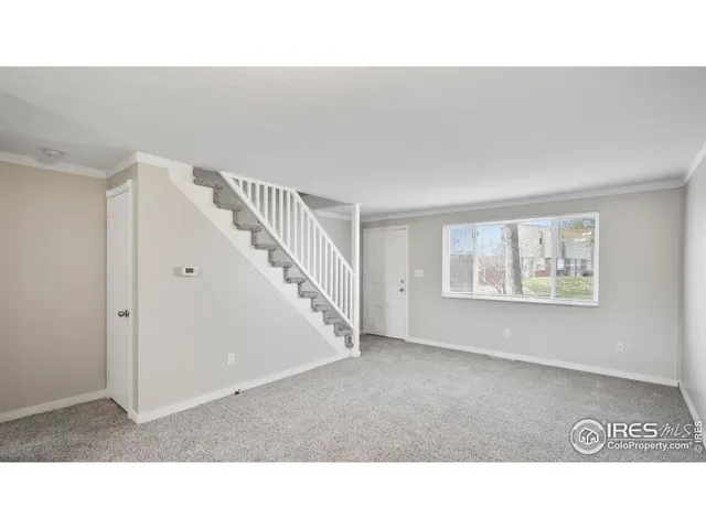 a black and white photo of a living room