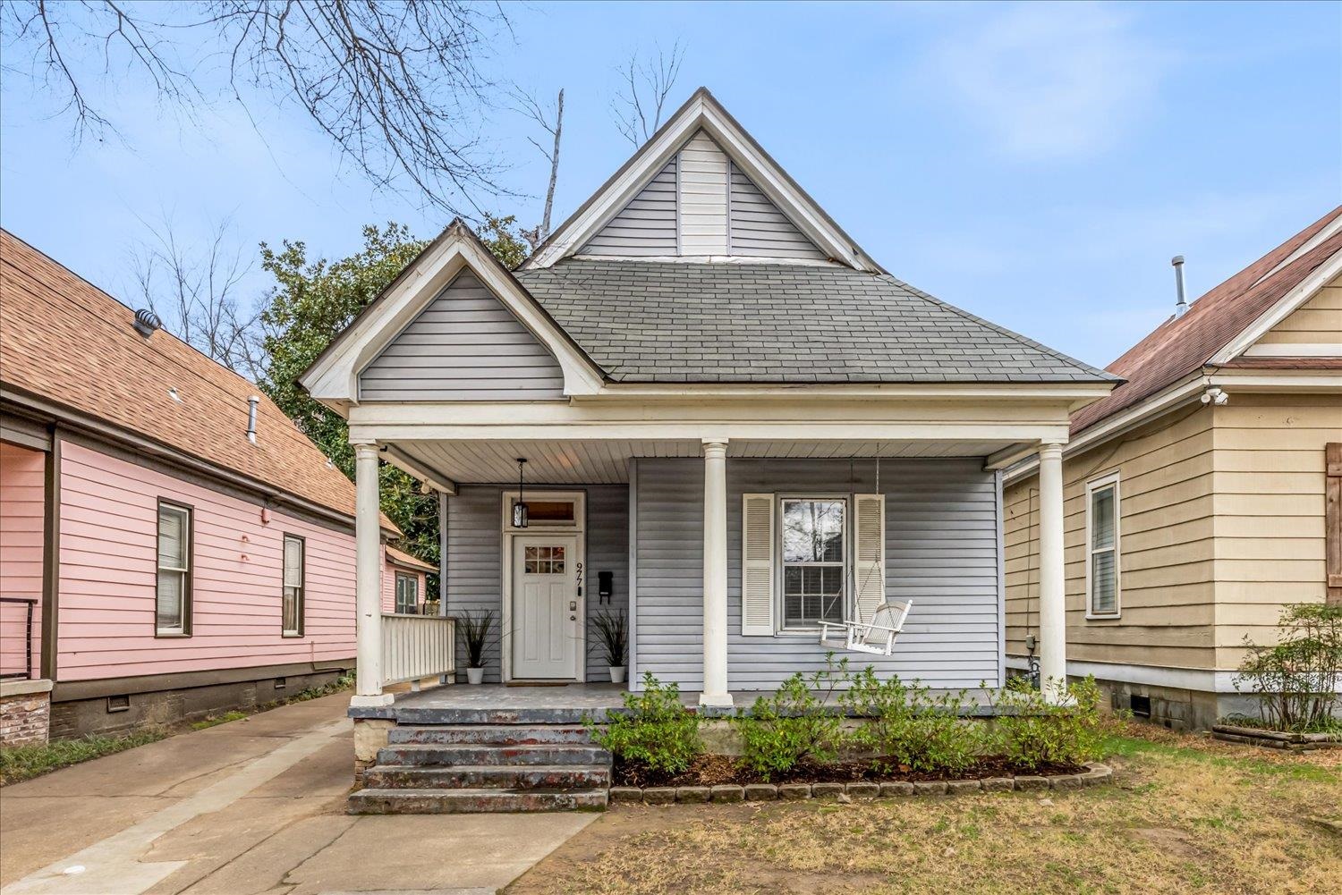 977 Philadelphia Street Memphis, TN 38104 - Photo 2 of 14 a front view of a house with a yard