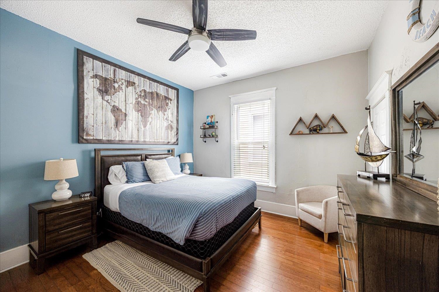 977 Philadelphia Street Memphis, TN 38104 - Photo 6 of 14 a bedroom with a bed wooden floor and window