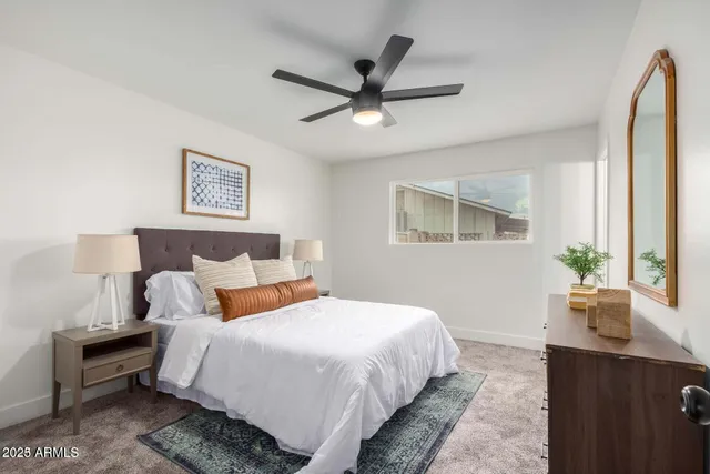 a bedroom with bed and window