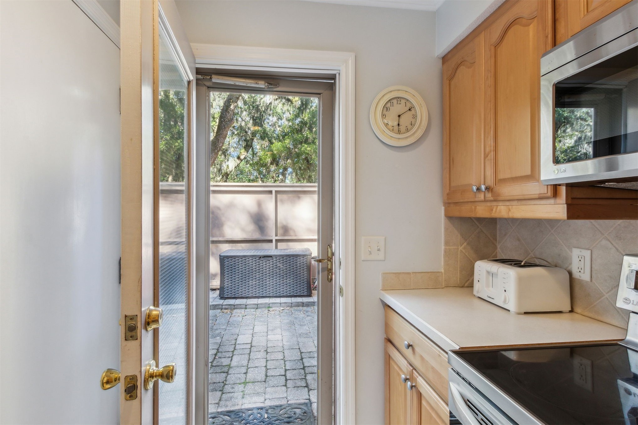 3323 Sea Marsh Road, Unit 3323 Fernandina Beach, FL 32034 - Photo 10 of 47 a kitchen with a refrigerator and countertop