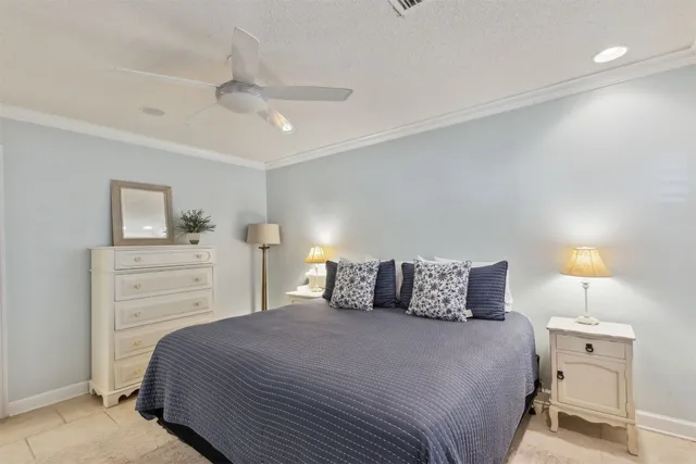 a bedroom with a bed and a night stand