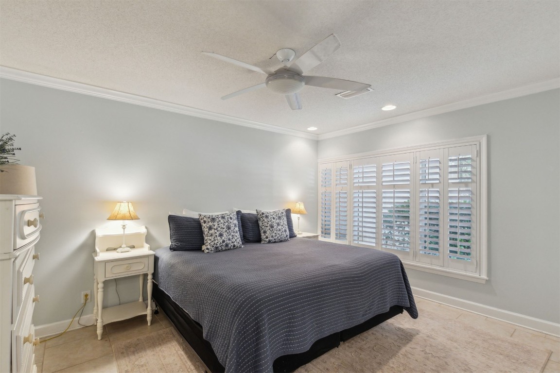 3323 Sea Marsh Road, Unit 3323 Fernandina Beach, FL 32034 - Photo 23 of 48 a bedroom with a bed and a window