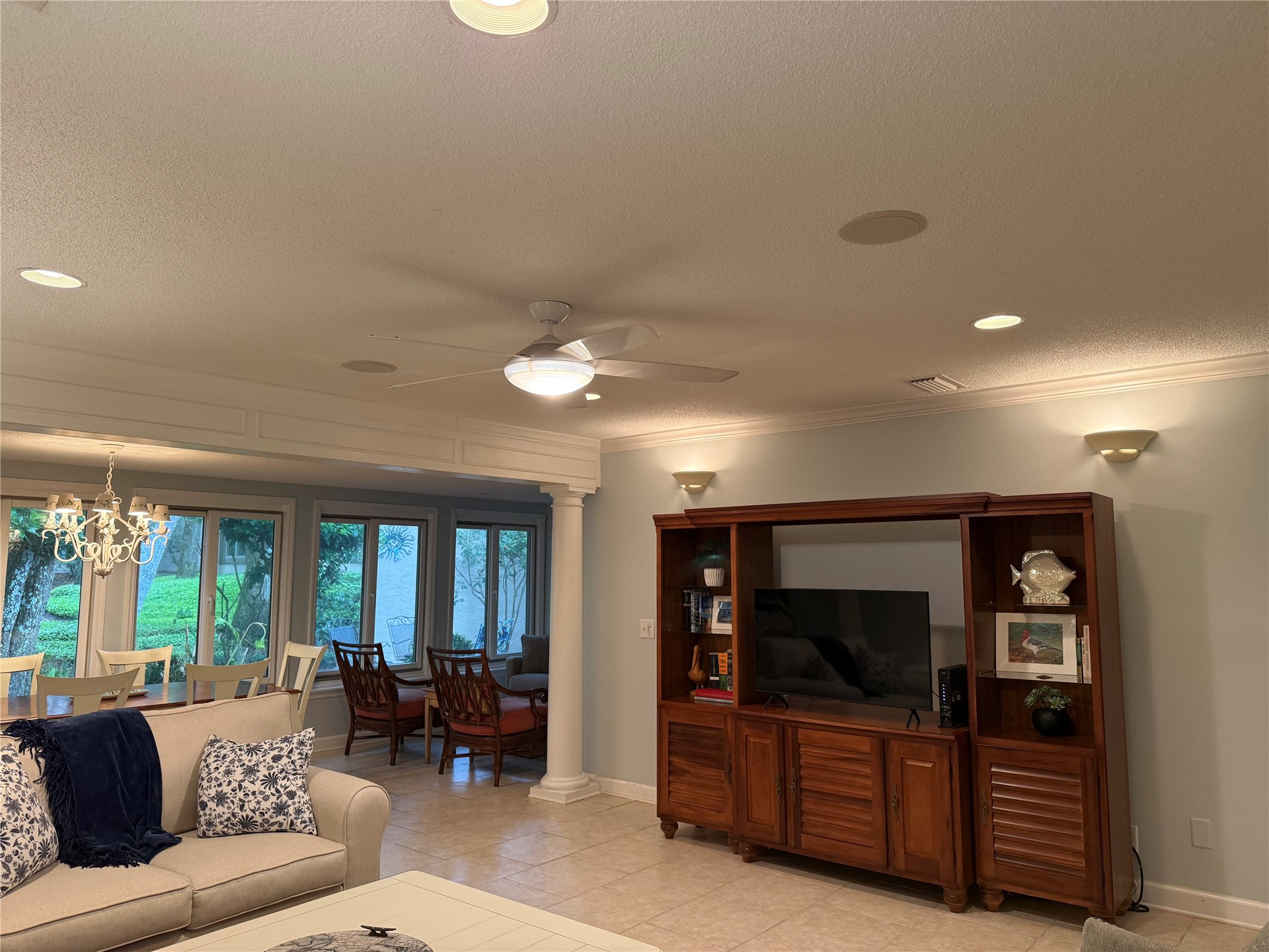 3323 Sea Marsh Road, Unit 3323 Fernandina Beach, FL 32034 - Photo 4 of 47 a living room with furniture and a flat screen tv