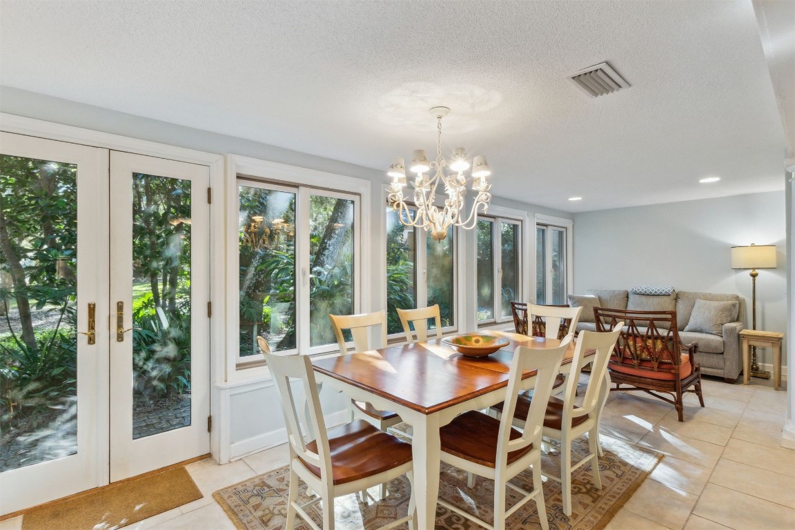 3323 Sea Marsh Road, Unit 3323 Fernandina Beach, FL 32034 - Photo 8 of 48 a view of a dining room with furniture window and outside view