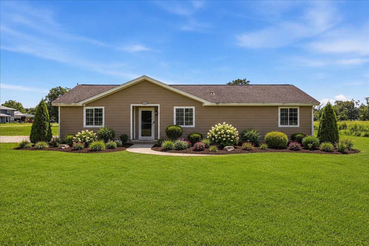 Digitally enhanced image to show an example of what the front of the home could look like with landscaping