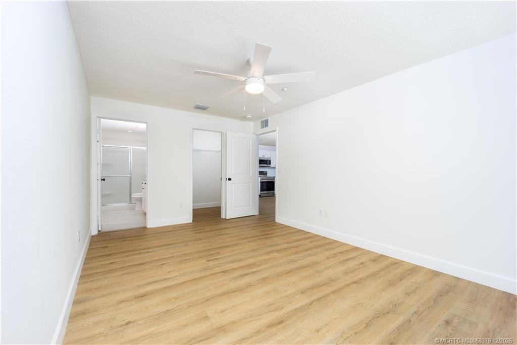 3375 Southwest Mapp Road, Unit 201 Palm City, FL 34990 - Photo 5 of 19 a view of empty room with wooden floor