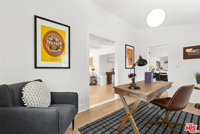 a living room with furniture and a rug