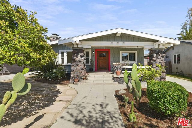 a front view of house with yard outdoor seating
