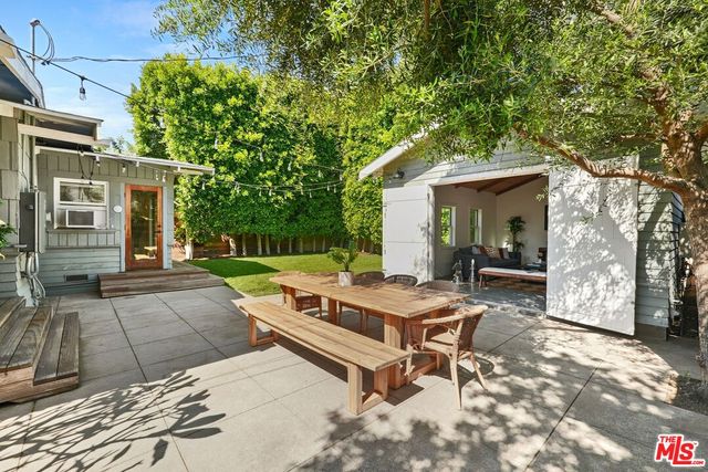 a view of a backyard with sitting area