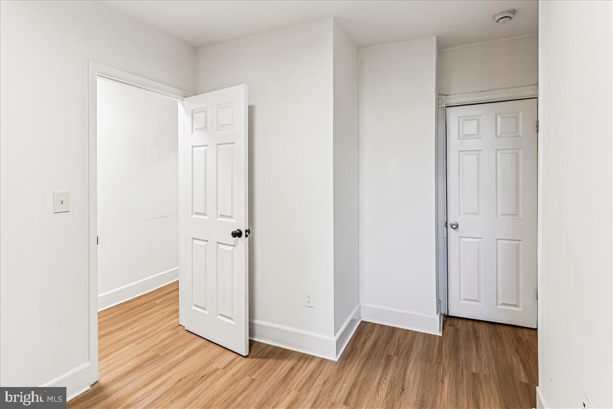 2023 Division Street Baltimore, MD 21217 - Photo 14 of 35 a view of a hallway with wooden floor