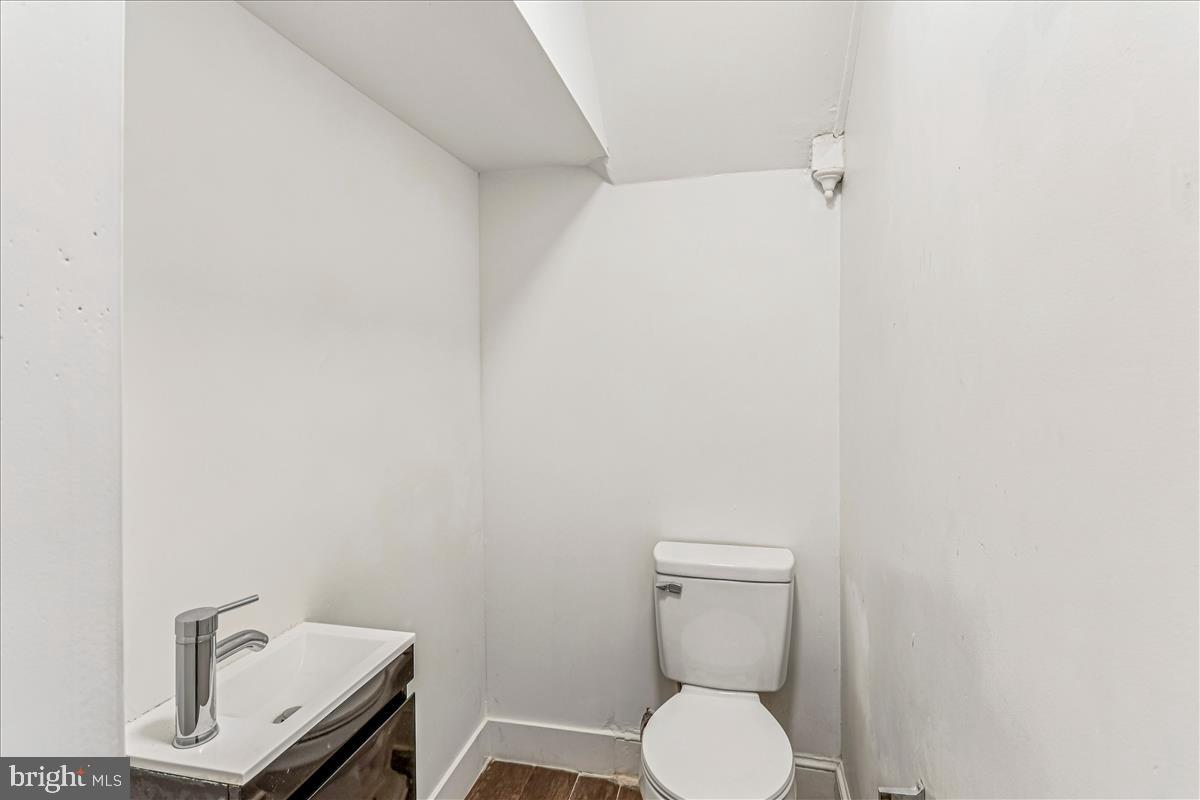 2023 Division Street Baltimore, MD 21217 - Photo 16 of 35 a bathroom with a toilet