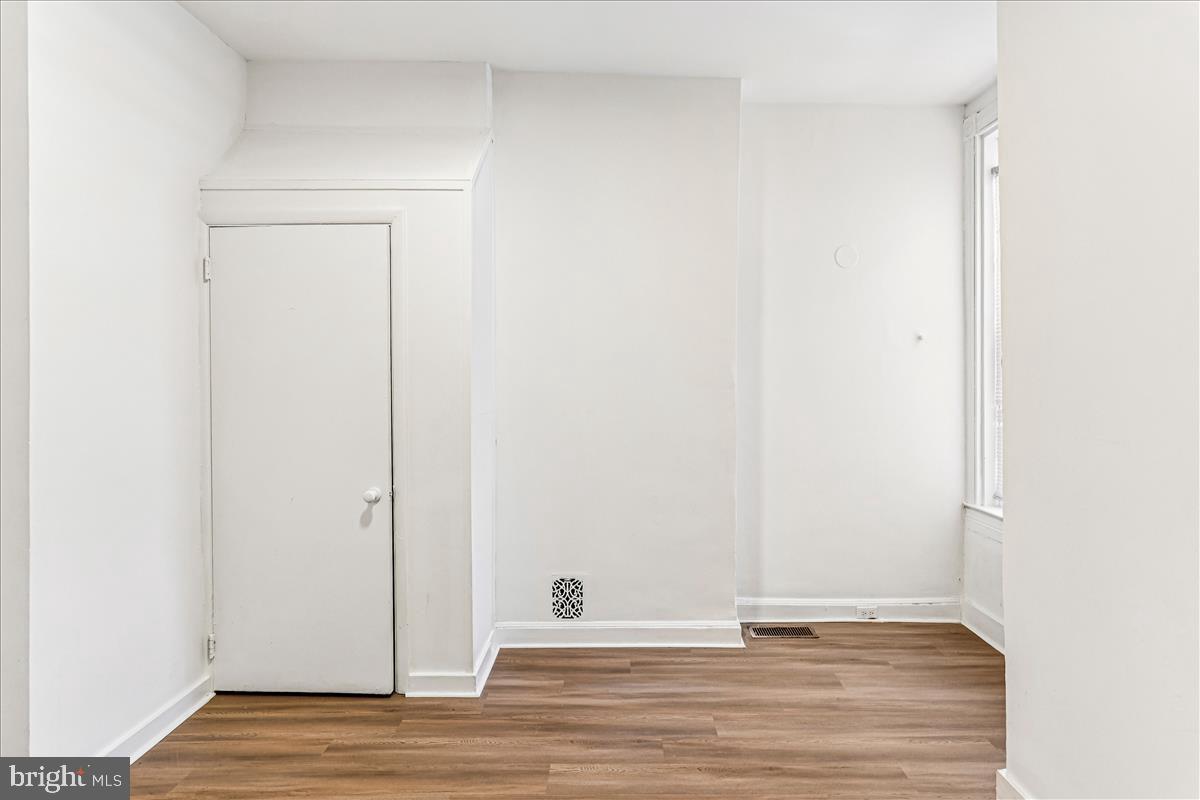 2023 Division Street Baltimore, MD 21217 - Photo 26 of 35 a view of empty room with wooden floor