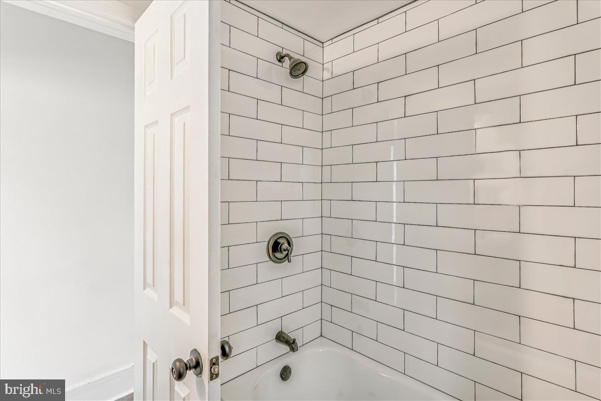 2023 Division Street Baltimore, MD 21217 - Photo 28 of 35 a bathroom with a shower