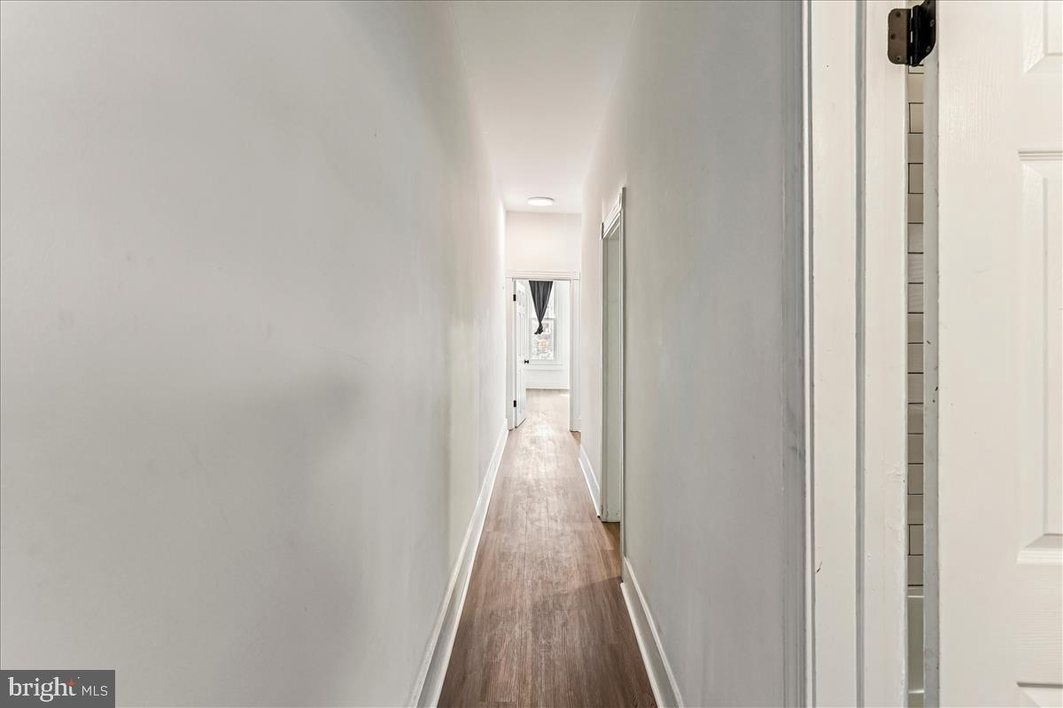 2023 Division Street Baltimore, MD 21217 - Photo 33 of 35 a view of a hallway with wooden floor