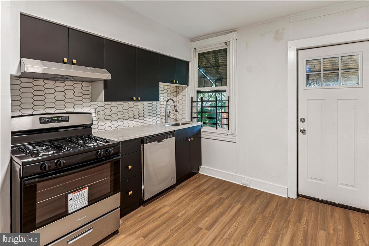 2023 Division Street Baltimore, MD 21217 - Photo 7 of 35 a kitchen with a stove and a microwave