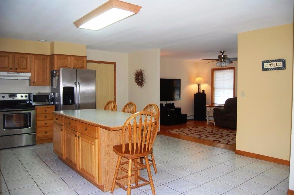 207 Ridge Road Monmouth, ME 04259 - Photo 7 of 25 KITCHEN LOOKING INTO LIVING ROOM