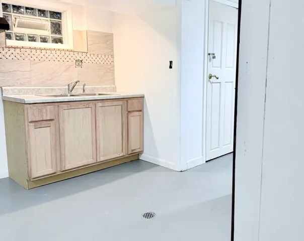 a view of a sink and closet