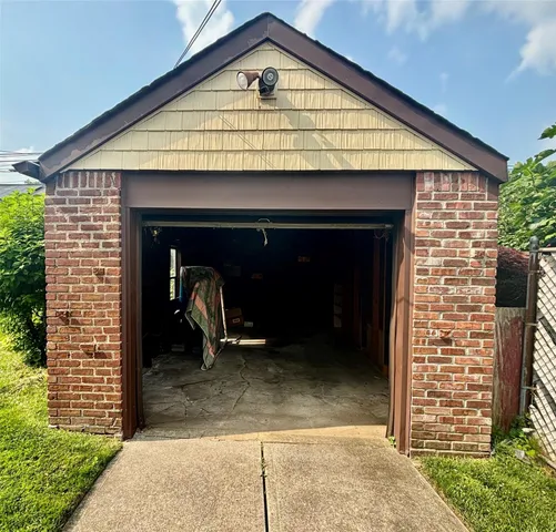 a view of a wooden house with a large door